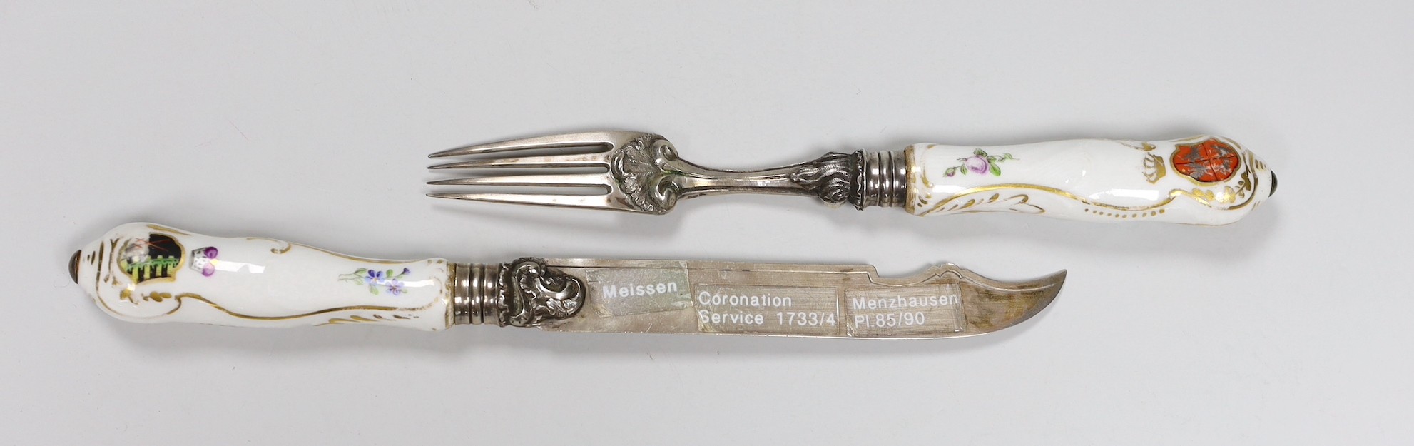 A German porcelain handled silver knife and fork, armorial crests